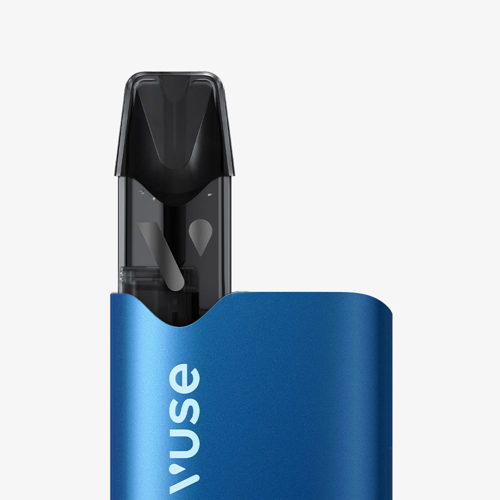 A close-up of a blue Recharge Standards Saveur Blend Classique vape device with a black mouthpiece, partially visible against a plain white background, evokes the refined simplicity of café-style enjoyment.