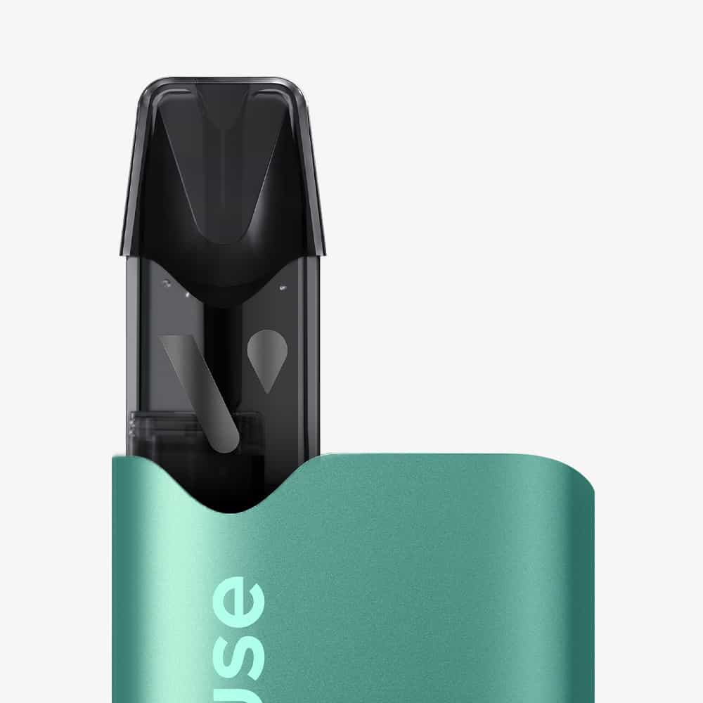 A close-up of the green Recharge Gamme Intense Saveur Menthe Ice vape with a black mouthpiece, partially inserted in its matching case, alongside menthe capsules on a plain white background.